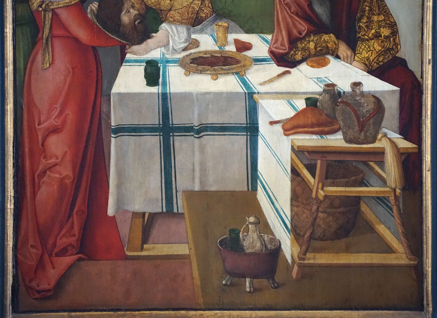 Johanniskirche / Hochaltar / erste Wandlung Gastmahl des Herodes, Detailansicht mit einer sicherlich aus dem Baskenland stammenden Decke und Alltagsgegenständen