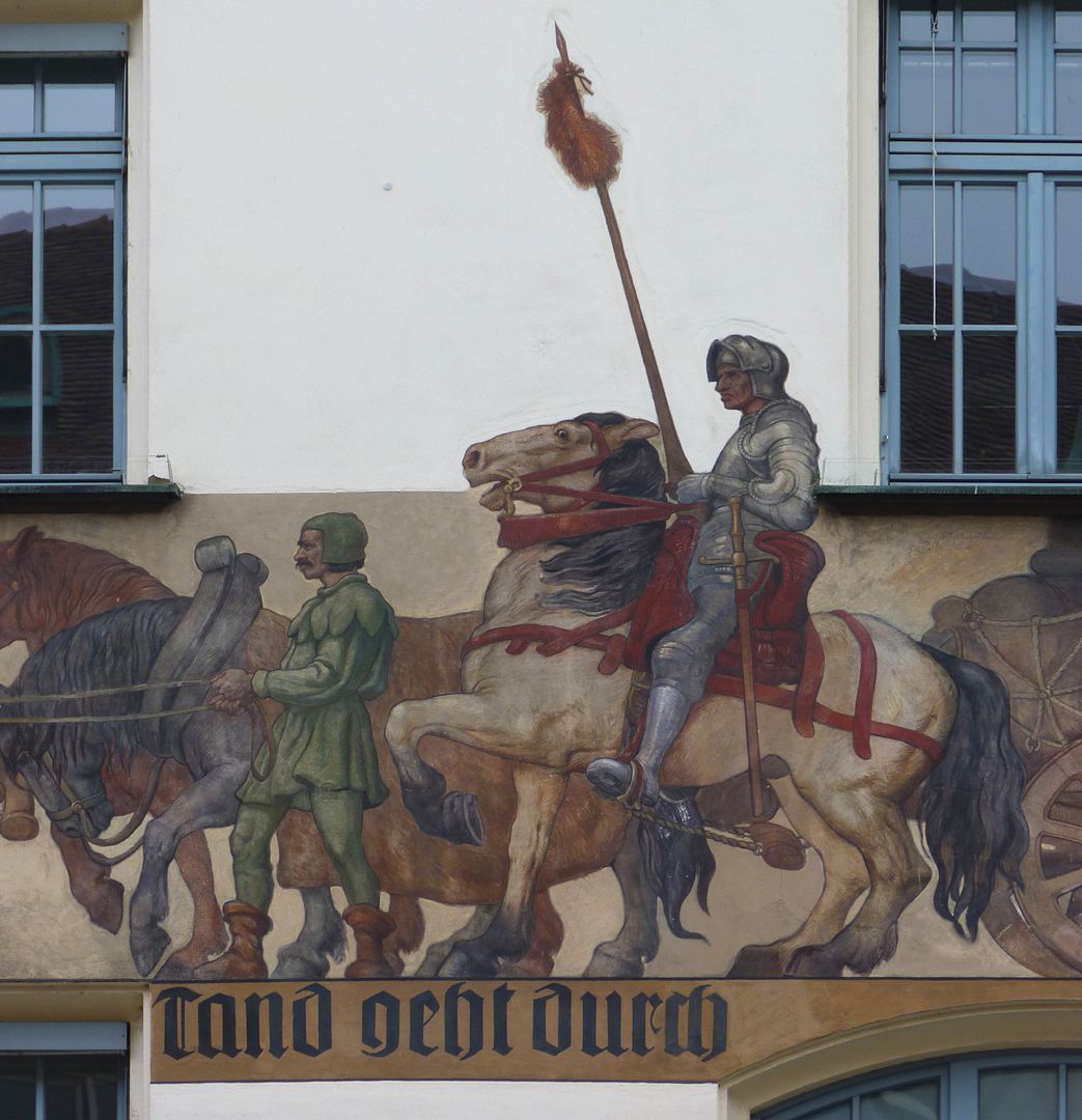 Kaufmannszug Ostfassade, Detail: Mittelteil des Zuges mit Wagenlenker und Ritter