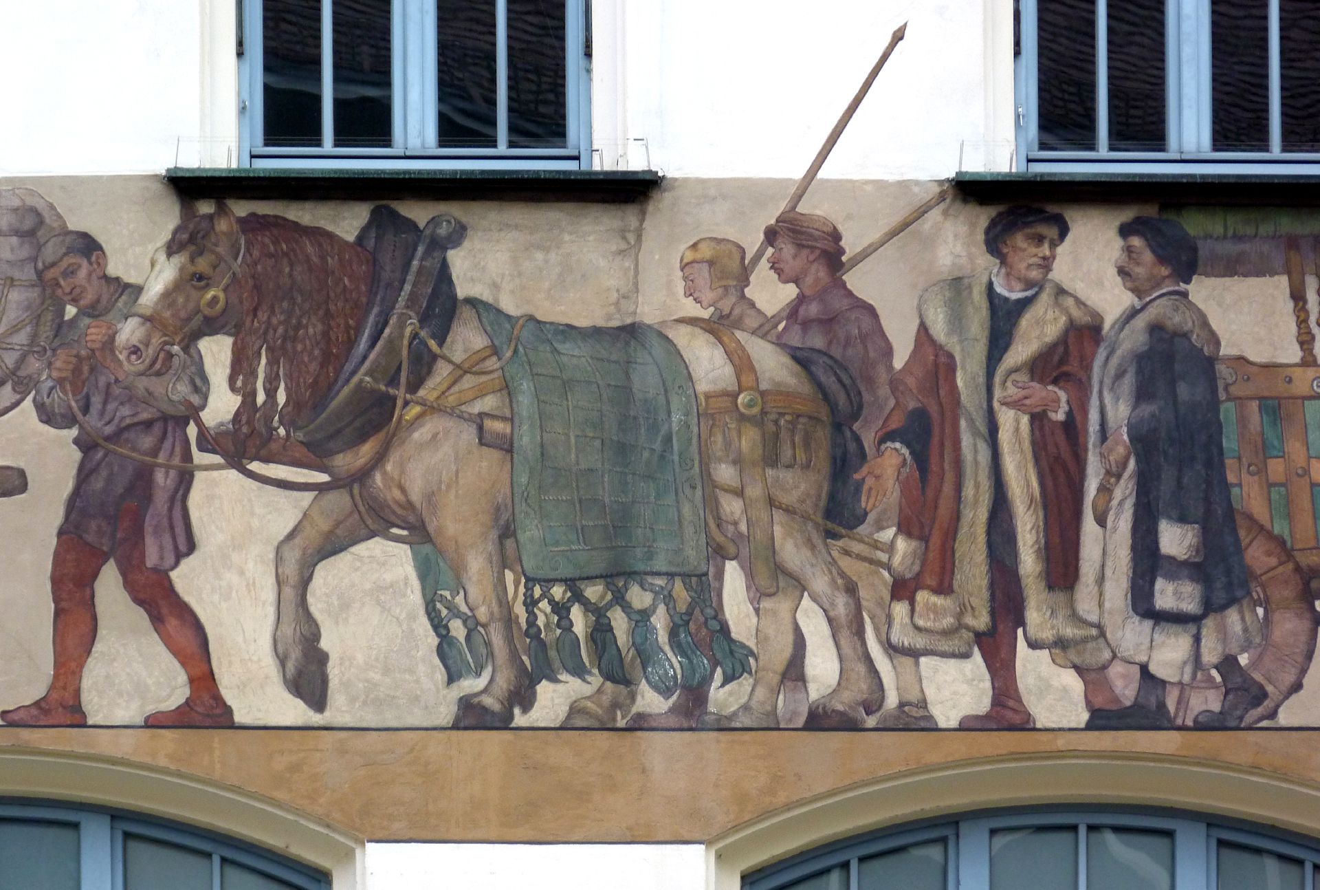 Kaufmannszug Ostfassade, Detail: Hinterer Wagen mit Knappen und Kaufleuten