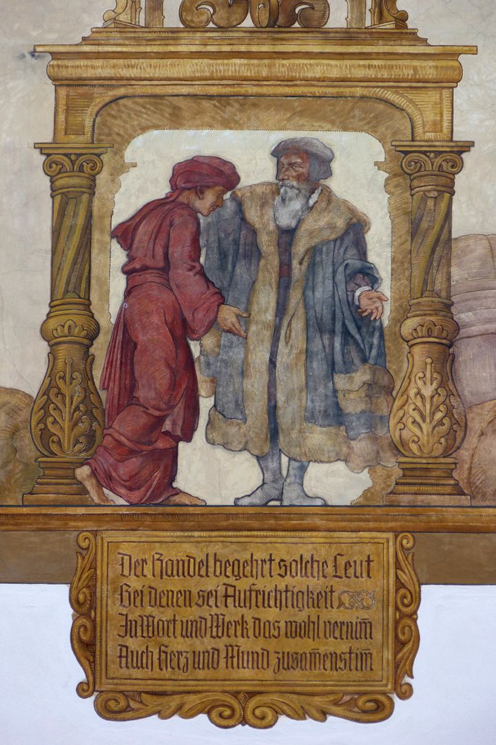 Kaufmannszug Südfassade, Allegorie des Überseehandels, Detail: Kaufgespräch und Spruchtafel